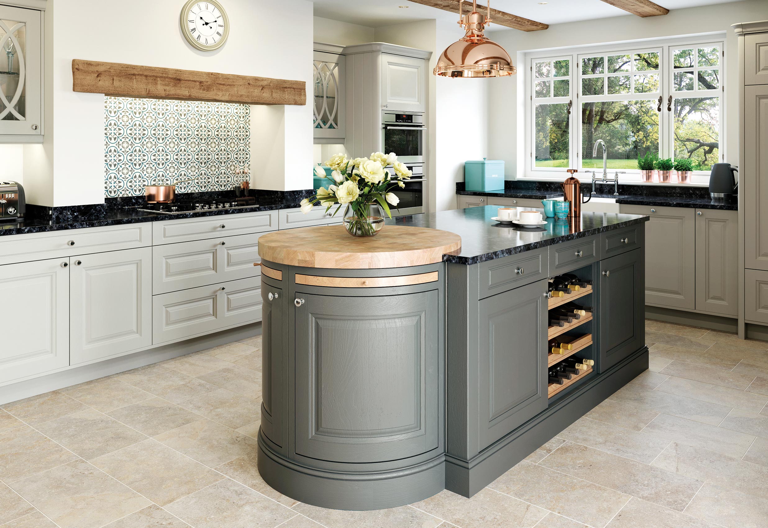 Matte painted stone and gun metal grey country style kitchen island view