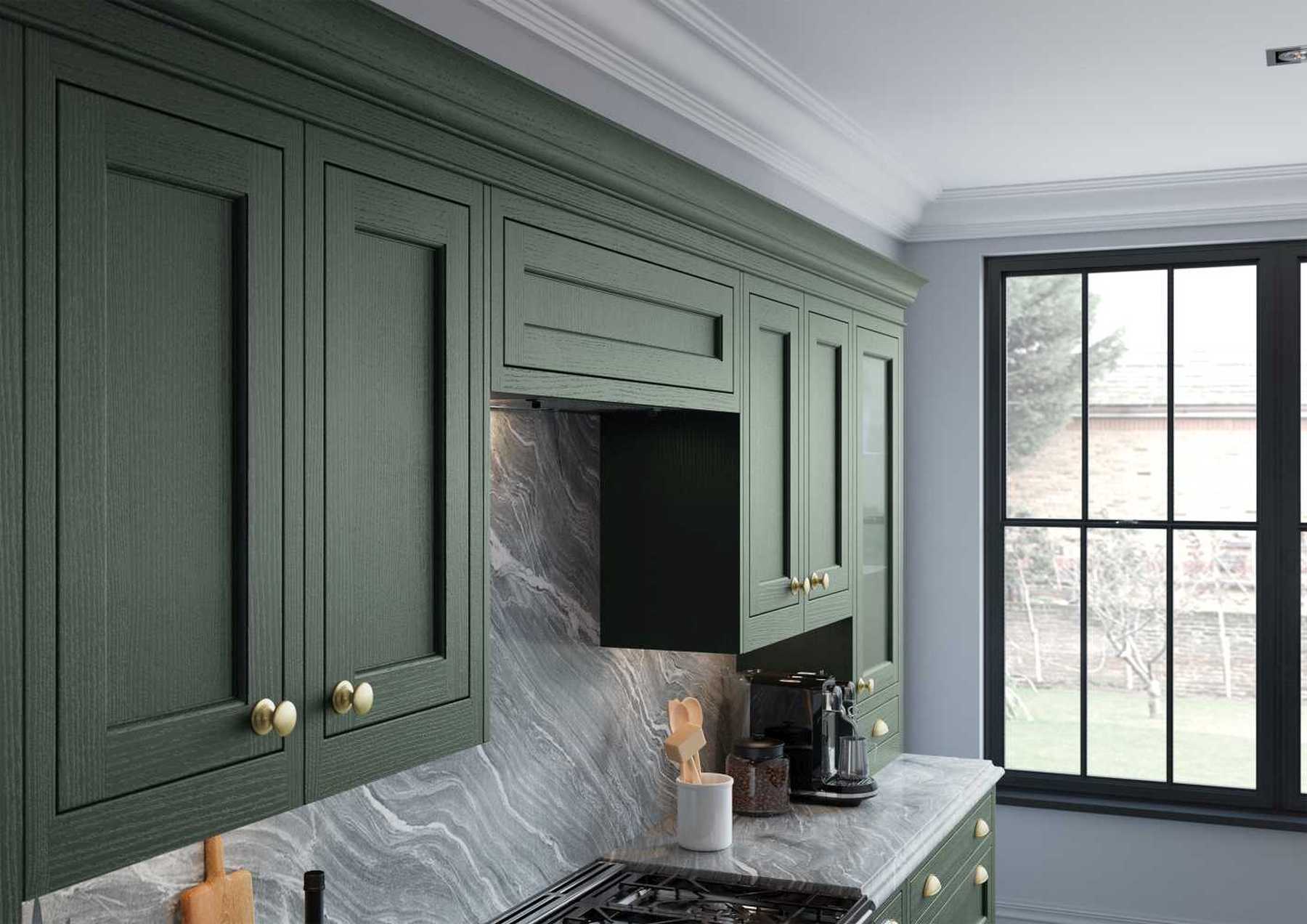 Luxurious inframe kitchen in forest green wall units
