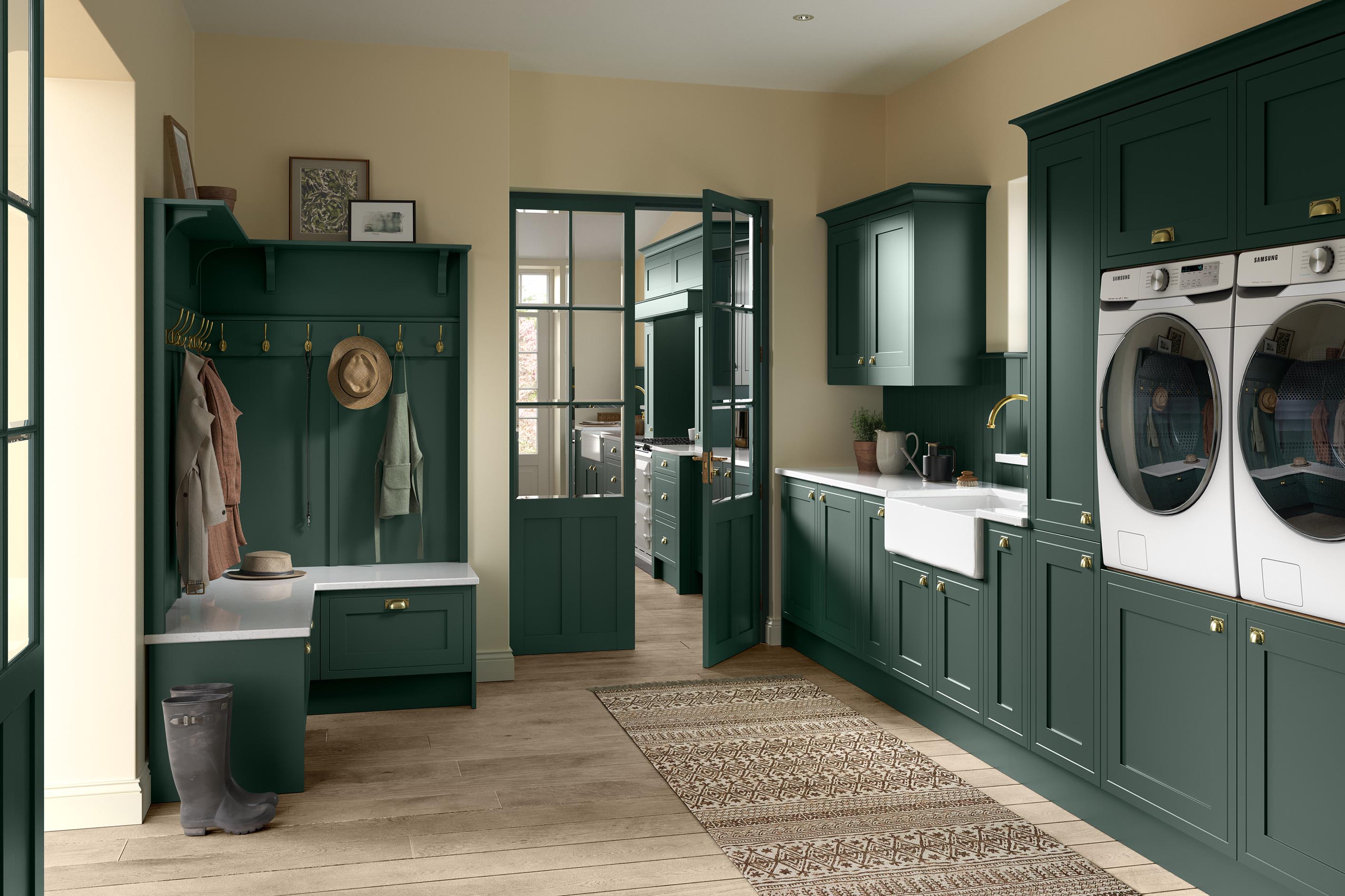 Mock In-Frame Shaker-Style Kitchen Painted Heritage Green featuring adjoining utility room with belfast sink, eye-level appliances and coat-hanging area with integrated bench. 