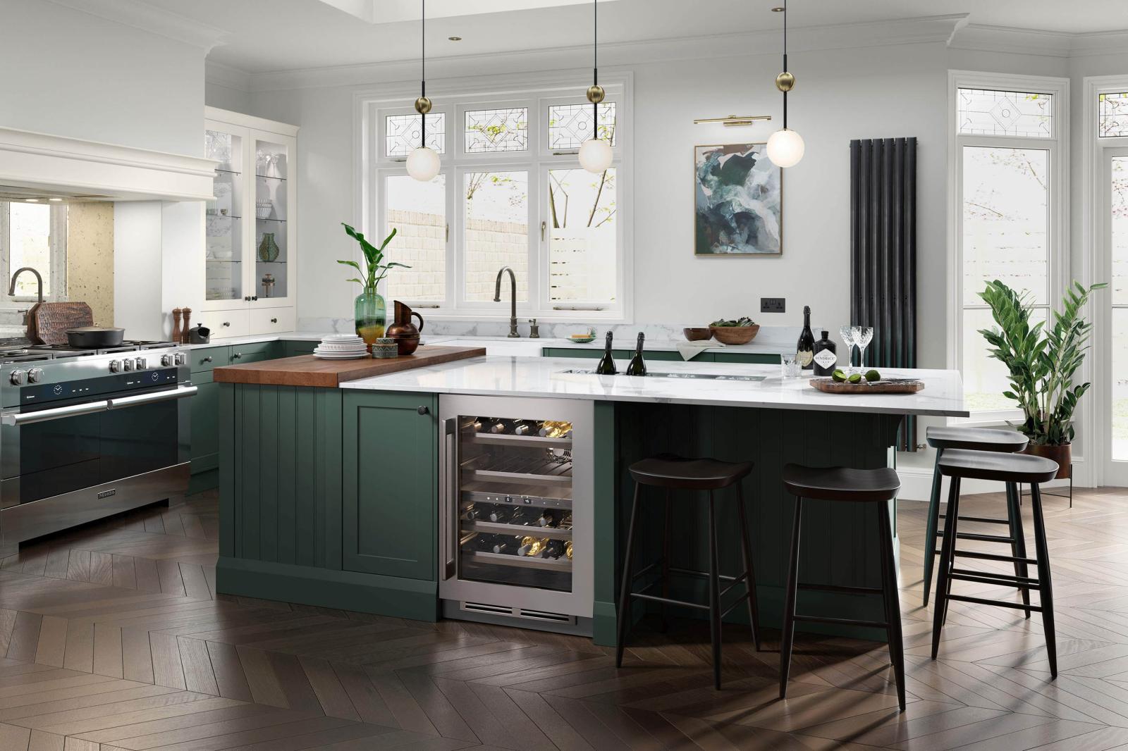 Smooth-finish, slim-frame, shaker-style kitchen painted heritage green and porcelain featuring island unit with central integrated ice bucket and pendant lighting. 