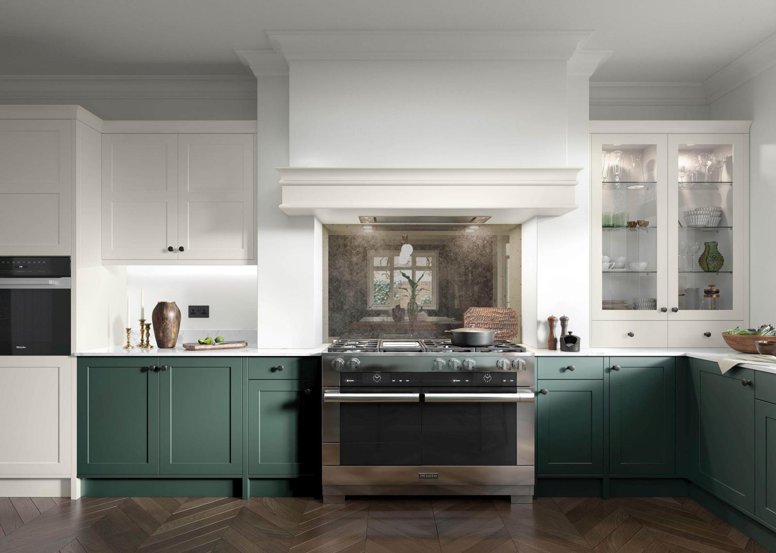 Smooth-finish, slim-frame, shaker-style kitchen painted heritage green and porcelain featuring range cooker with above canopy housing recessed extractor fan. Vintage glass backsplash 