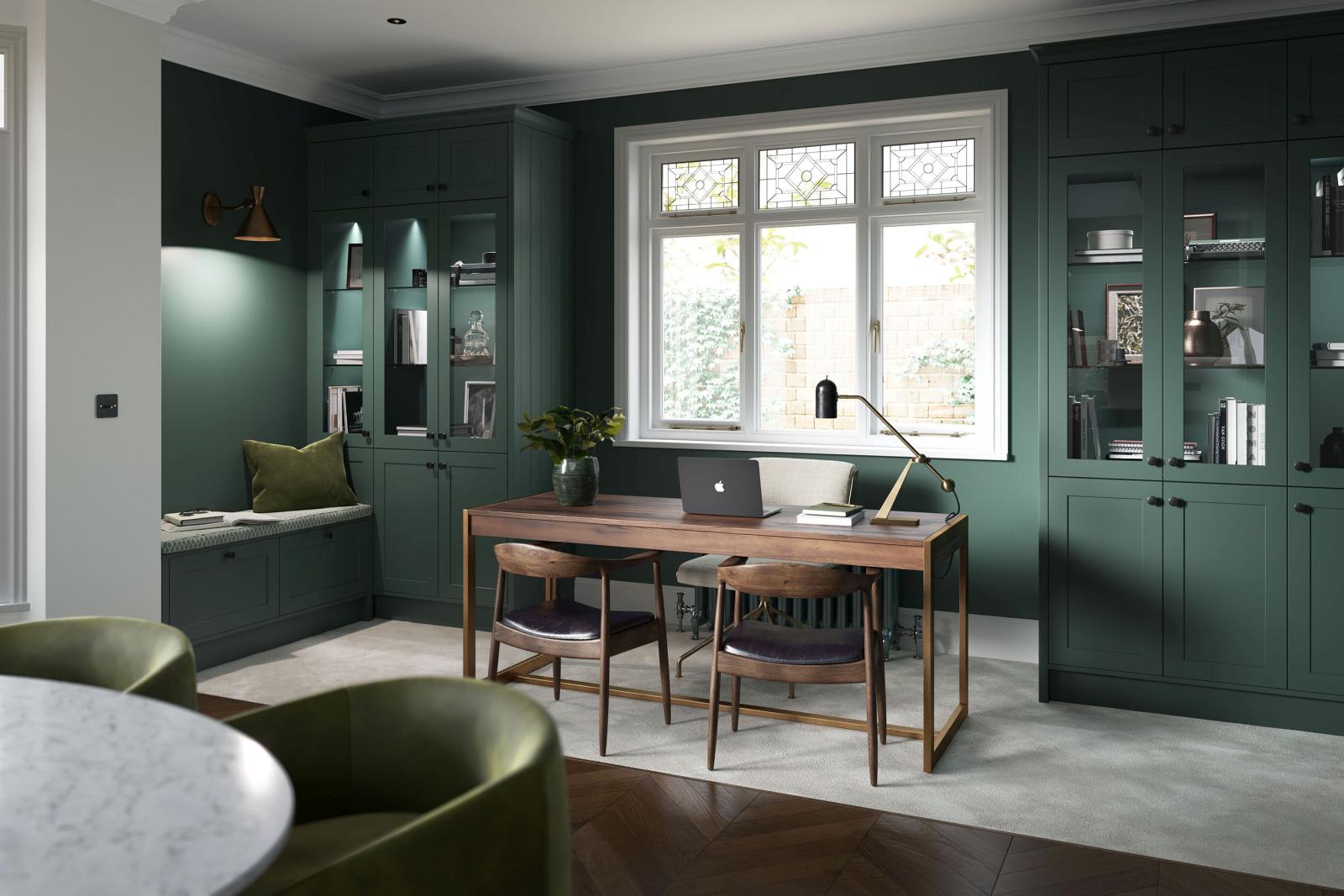 Smooth-finish, slim-frame, shaker-style kitchen painted heritage green and porcelain featuring home office area with symmetrical cabinets with top box cabinets for extra storage and height 