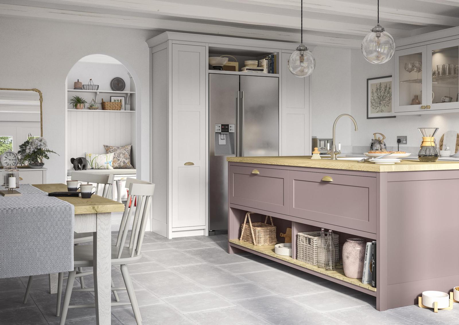 Smooth-finish, slim-frame, shaker-style kitchen painted vintage pink and light grey featuring island unit with pendant lighting above and an american fridge freezer framed by floor to ceiling cabinets