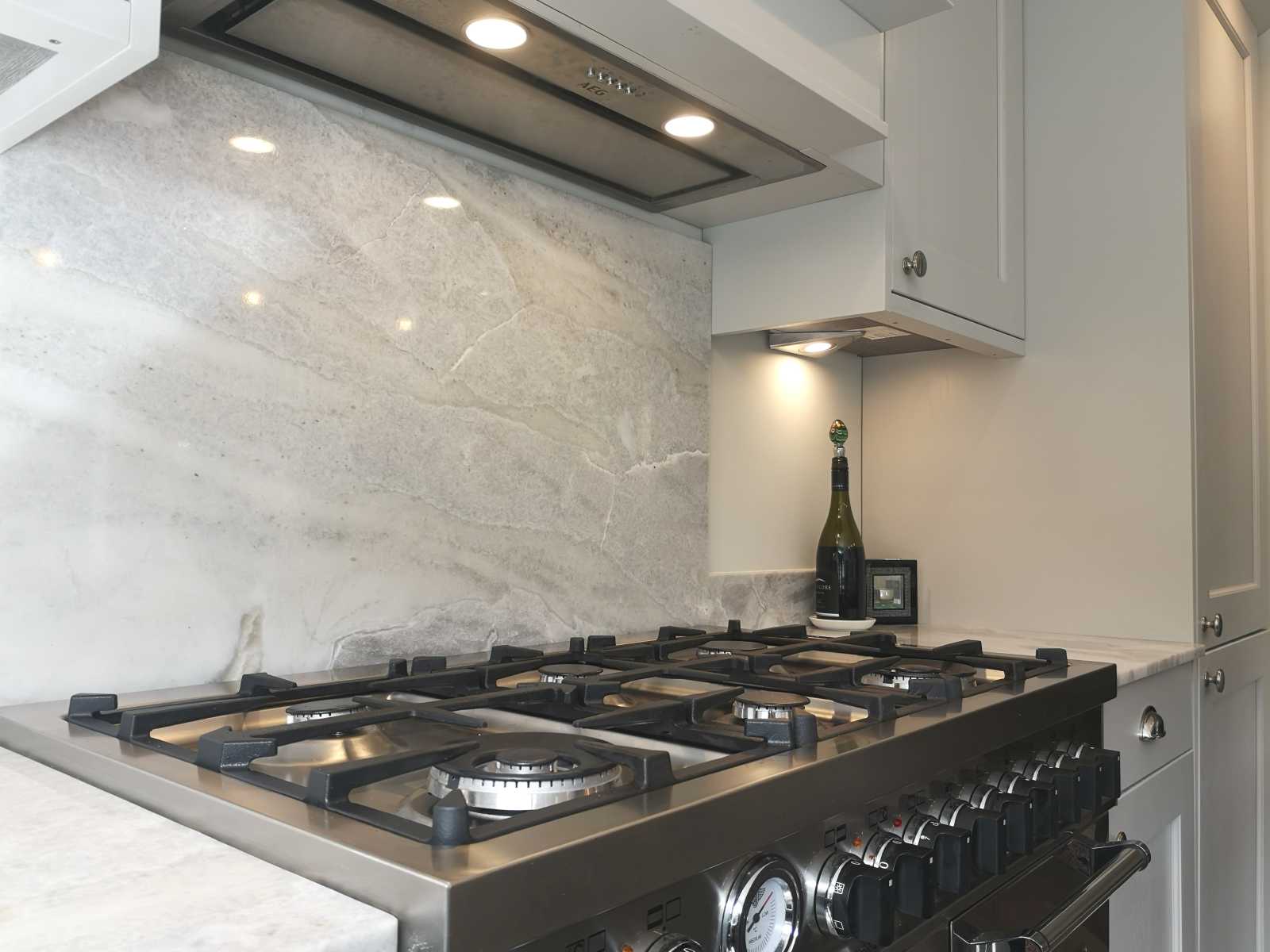 beaded shaker style kitchen painted light grey with bertazzoni range cooker close up