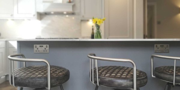 island painted dust grey with bar stool seating