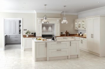 Traditional solid oak shaker kitchen painted cream with light marble and laquered wood worktops