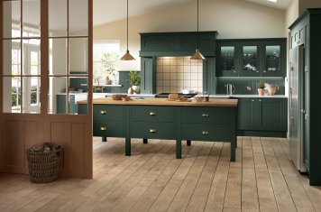 Mock In-Frame Shaker-Style Kitchen Painted Heritage Green featuring large freestanding island unit, pendant lighting, ada cooker, belfast sink, American fridge freezer and adjoining utility room